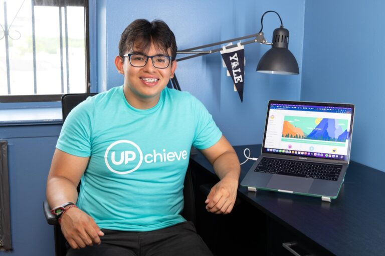 UPchieve student Aaron Custodio next to UPchieve on a computer